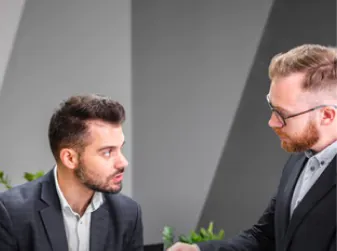 Two men are talking to each other